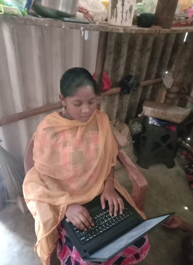 student in India using laptop